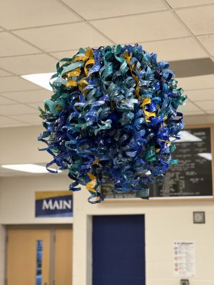 An image of a sculpture from painted water bottles.